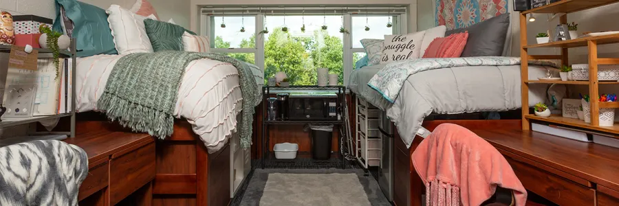 A decorated double bed dorm room