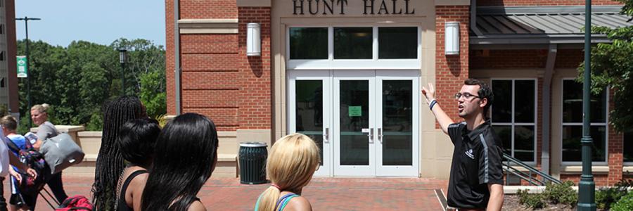 Students getting a tour outside of Hunt Hall