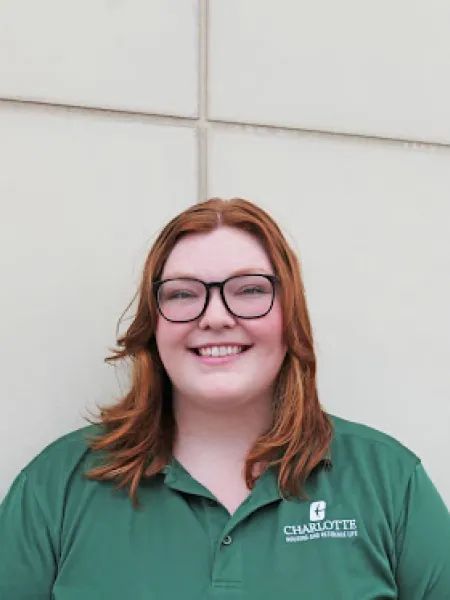 Carlee Trickle smiling in green polo