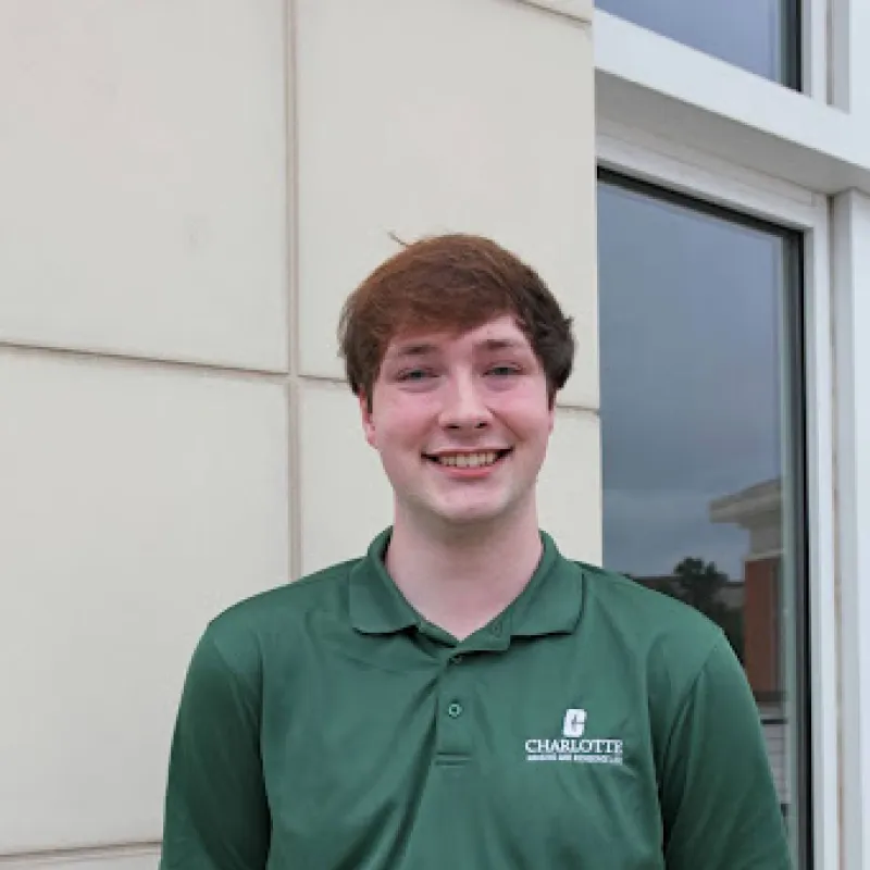 Maddox Morrow smiling in a green polo