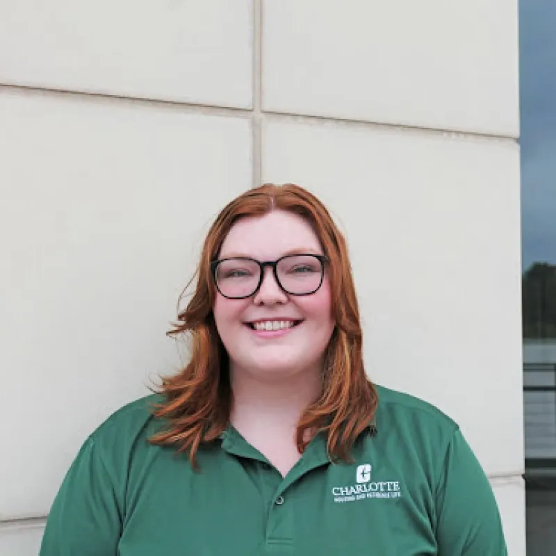 Carlee Trickle smiling in green polo